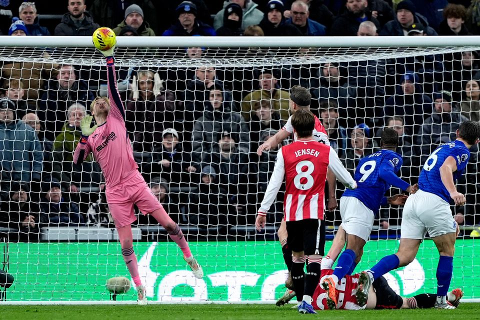 Brentford goalkeeper Caoimhín Kelleher makes a save from Everton's James Tarkowski (6) at the Hill Dickinson Stadium. Photo: Peter Byrne/PA Wire.